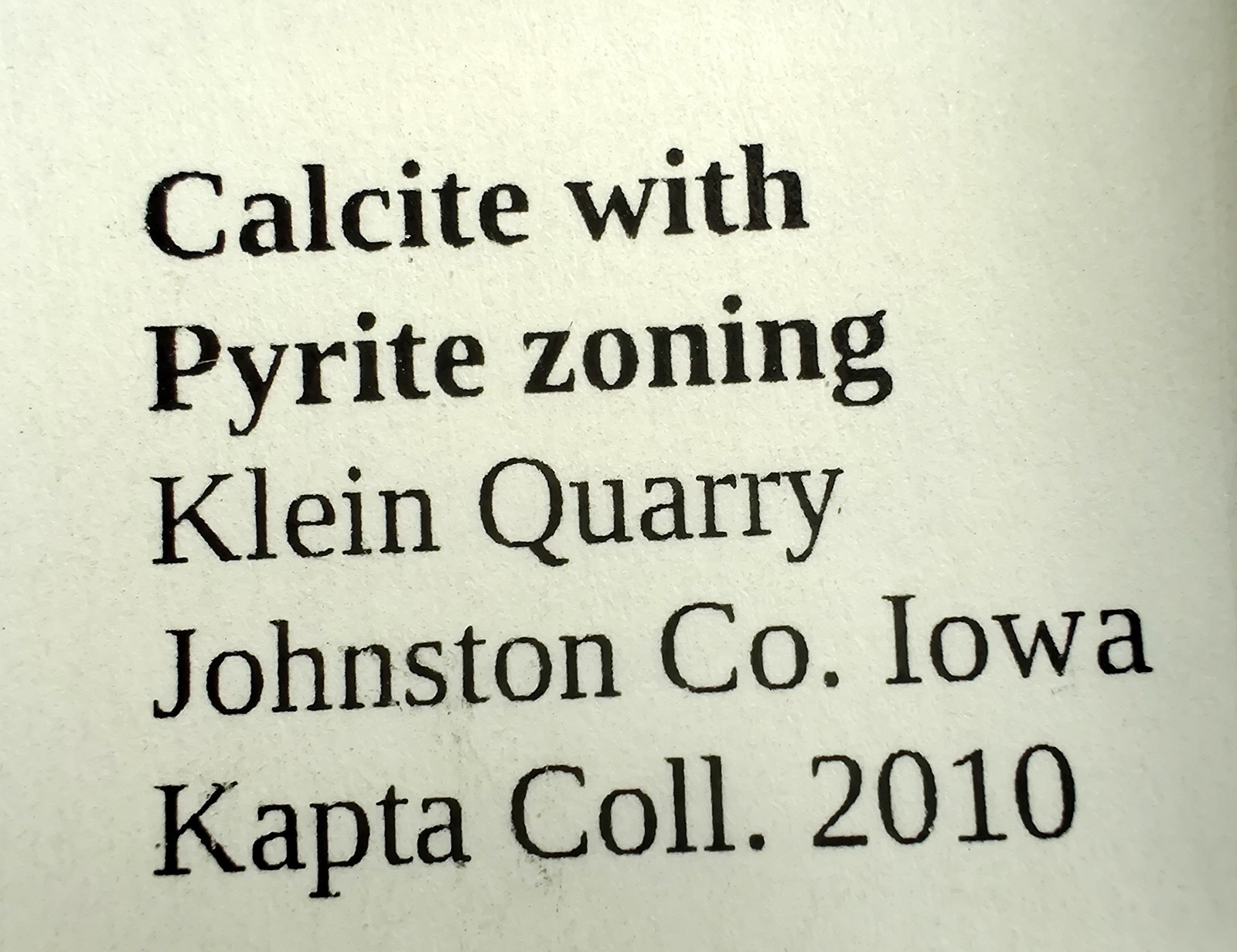 Calcite crystal with Pyrite crystals, fluorescent. Klein Quarry, Iowa. 45 grams.
