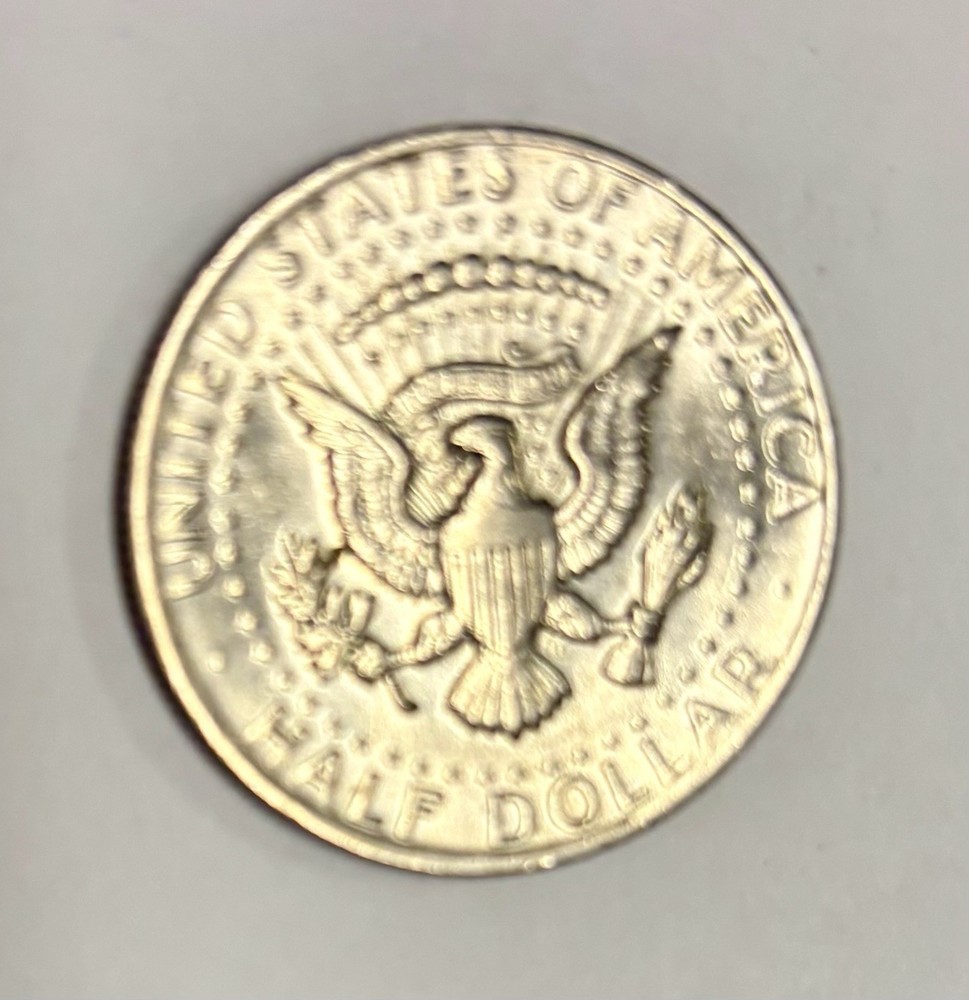 1973 Kennedy Half Dollar With No Mint Mark, Error On E