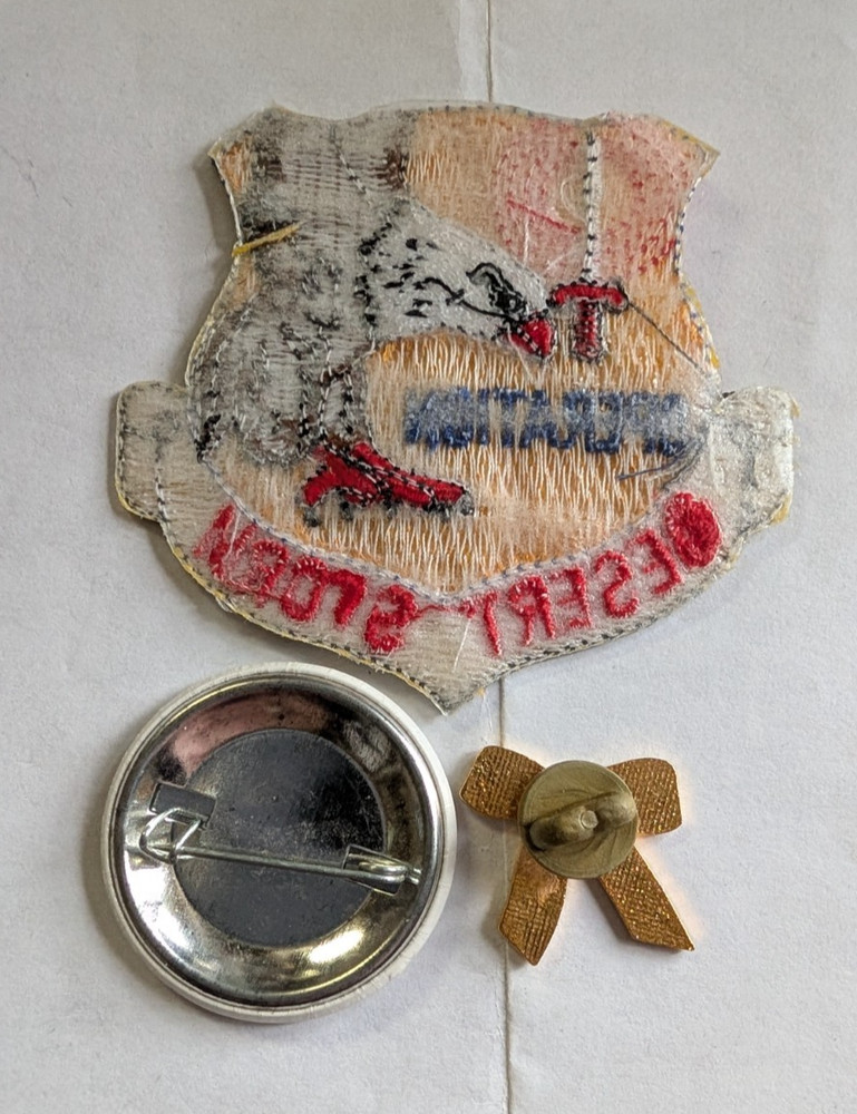 Operation Desert Storm pinback button, yellow ribbon pin, and patch