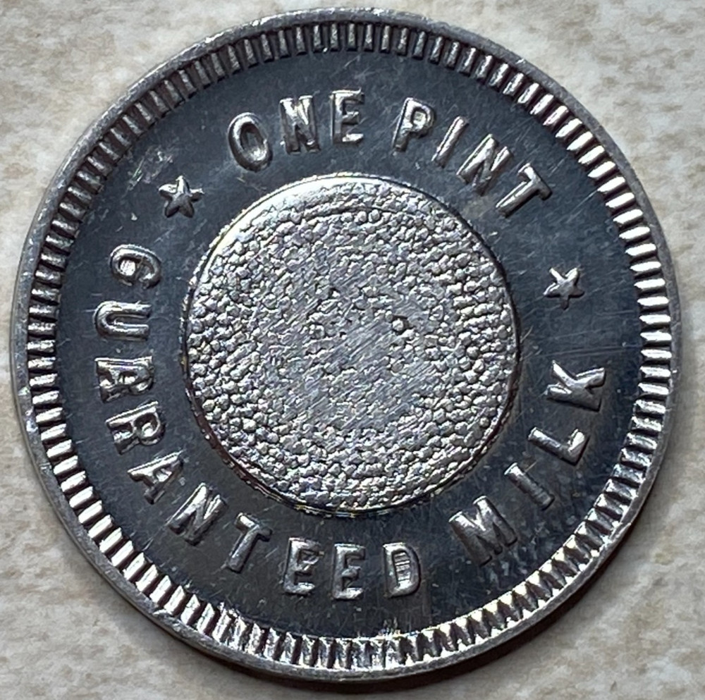 T9257 One Pint Guaranteed Milk, Unknown  Anillo Restrike Arcade Token
