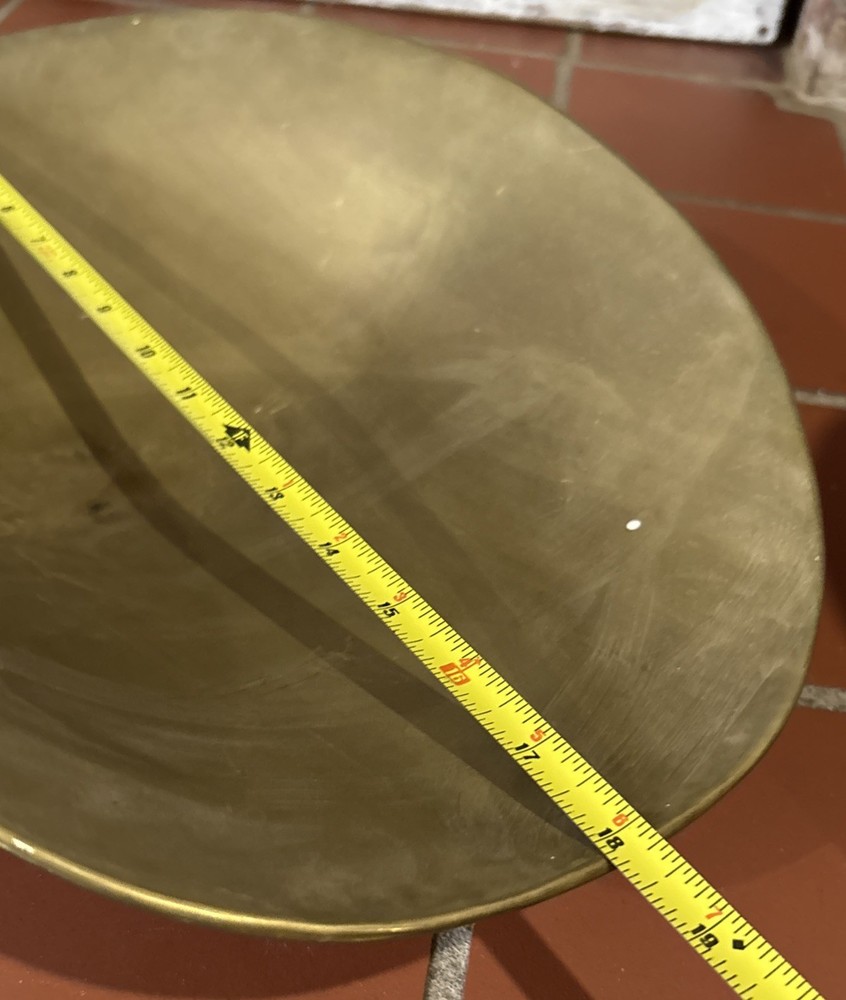 A large, antique solid brass mercantile scale pan.
