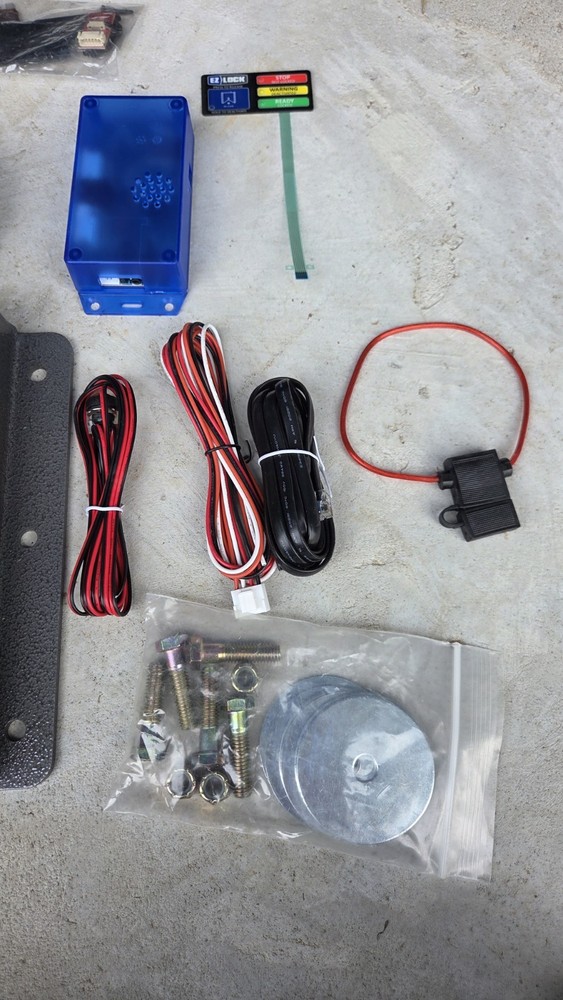 EZ Lock wheelchair lock down device like Qstraint Qlock