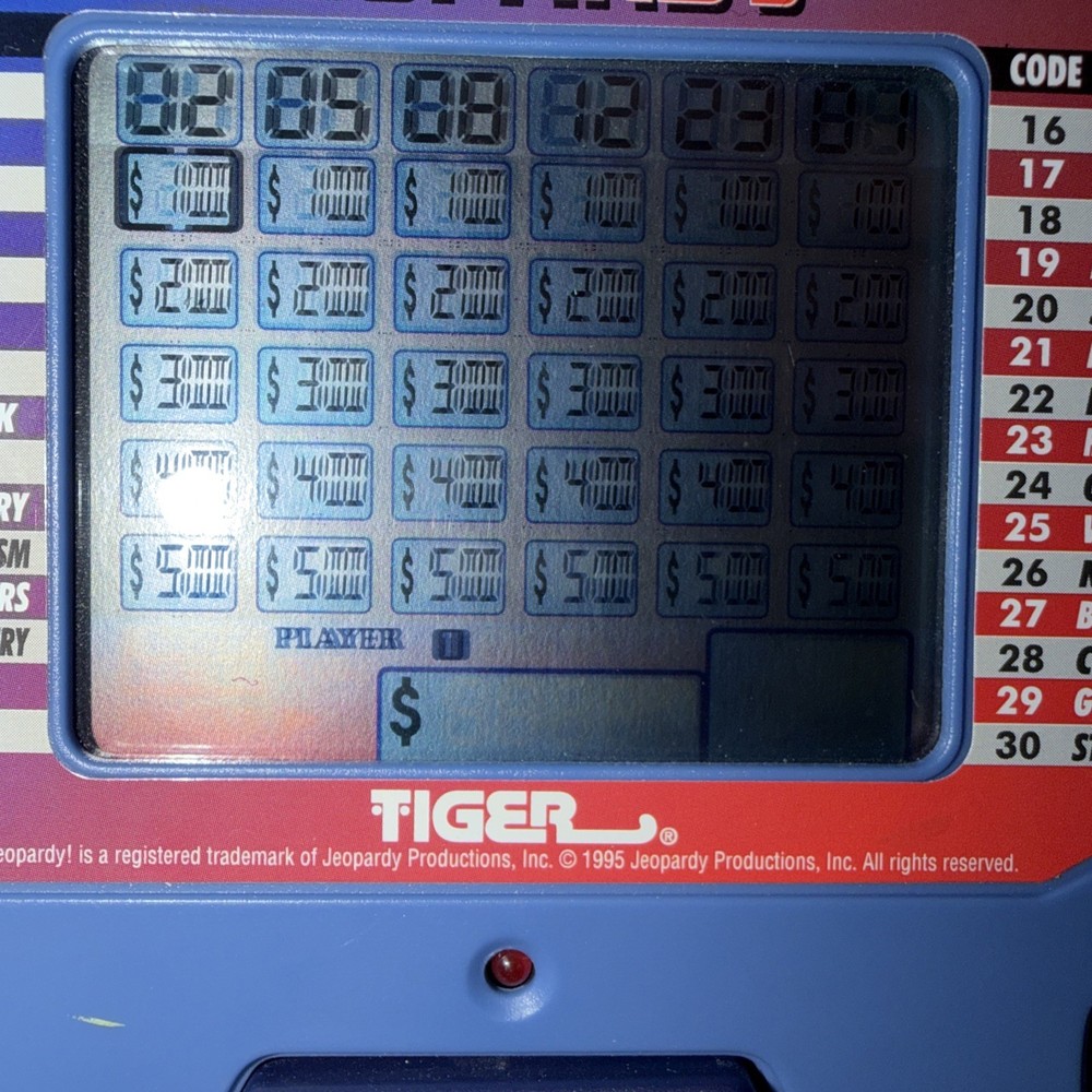 Tiger Electronics Jeopardy Handheld Game With Answer/question Book + Instruction