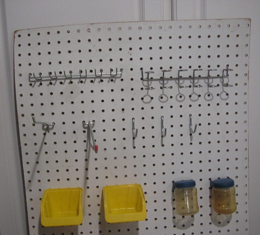 Composite Pegboard with Hooks and Bins Moounted