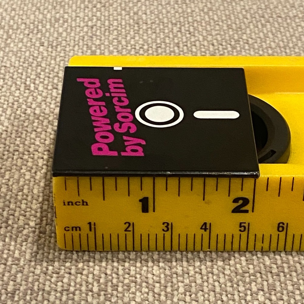 Vintage Powered by Sorcim Pinback Button Floppy Disk Software Tech Advertising