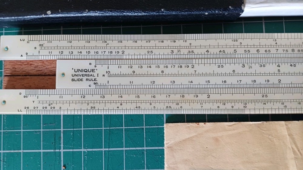Unique Universal Model 1 Slide Rule. Half-hour instructions. Case UK made.