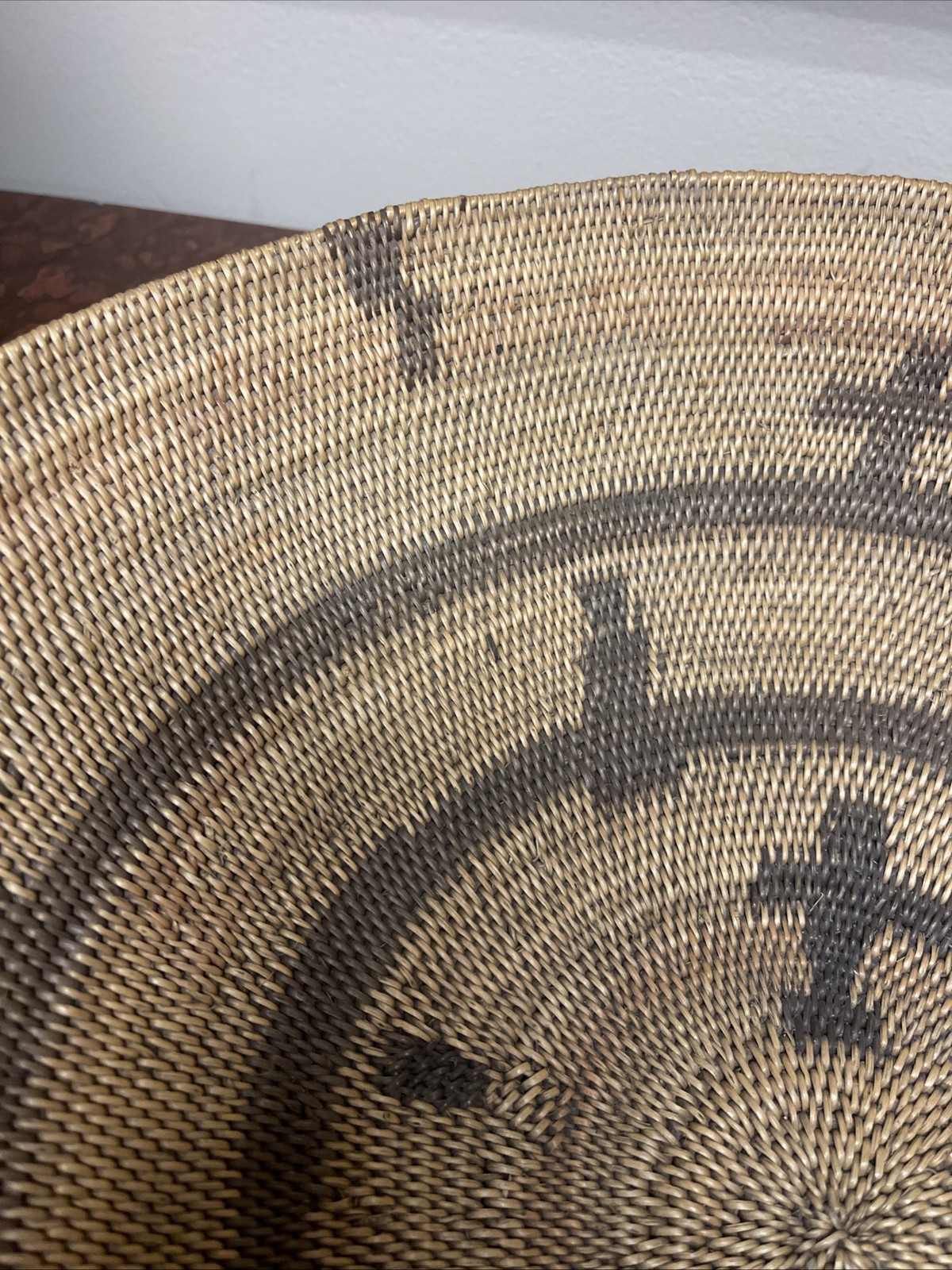 Woven Apache pictorial 17 1/4” basket with geometric and symbolic designs.
