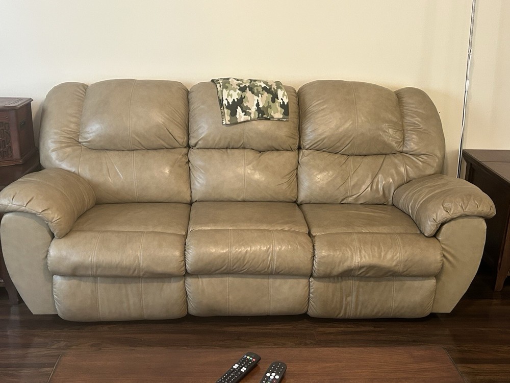 Beige Leather Reclining Sofa with Plush Cushions