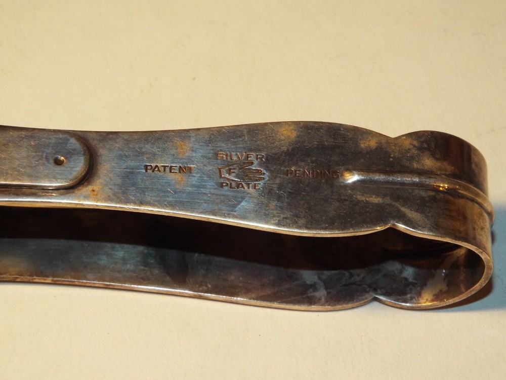 SILVERPLATE SQUEEZE SERVING SPOON STRAINER F AND HAND HALLMARK