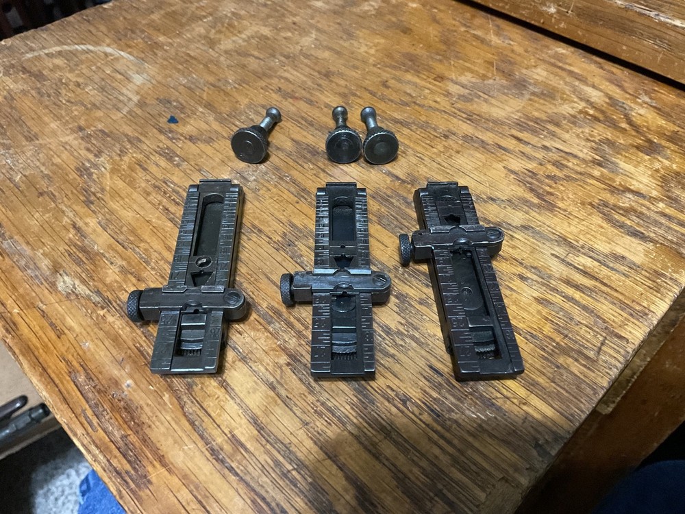 Remington 1903 sight base, leaf, slide, elevation, windage knobs marked R. 1 set