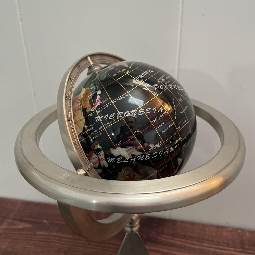 Rotating World Globe On Pyramid