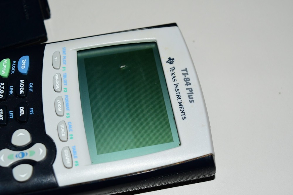 Texas Instruments TI-84 Plus Graphics Calculator with spot on OUTER screen works