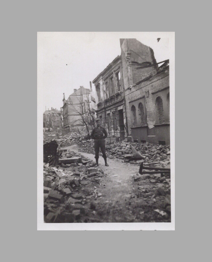 WW2 Era Photo U.S. GI Standing In Bombed City Ruins