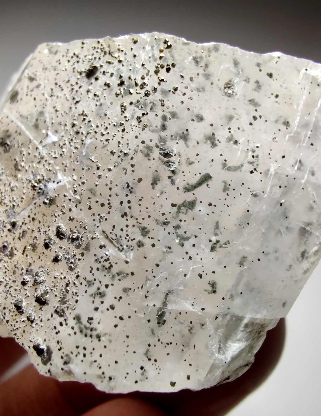 Calcite crystal with Pyrite crystals, fluorescent. Klein Quarry, Iowa. 45 grams.