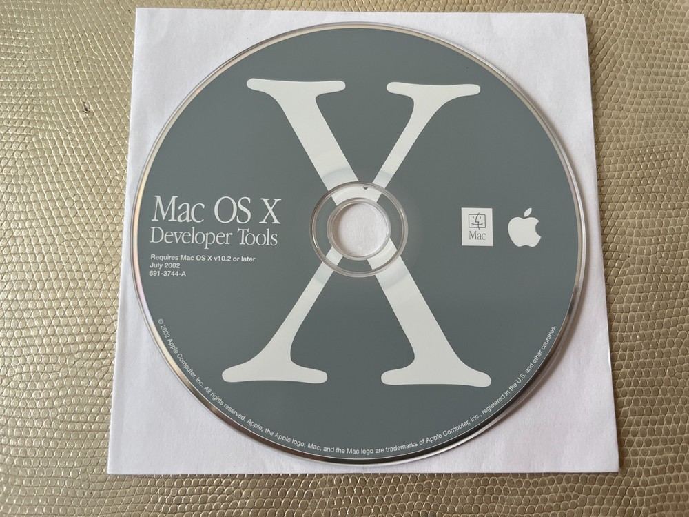Mac OS X 10.2 Jaguar install discs + developer tools disc and Mac OS X manual