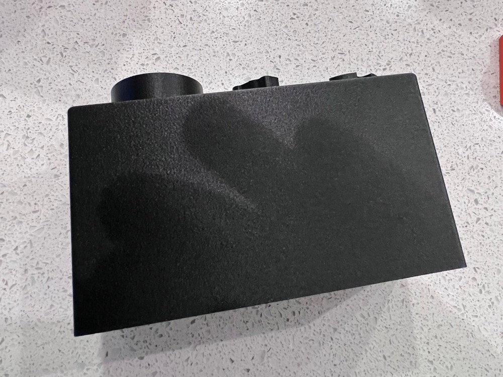 Rugged Obsidian piston/booster storage case and multi-tool