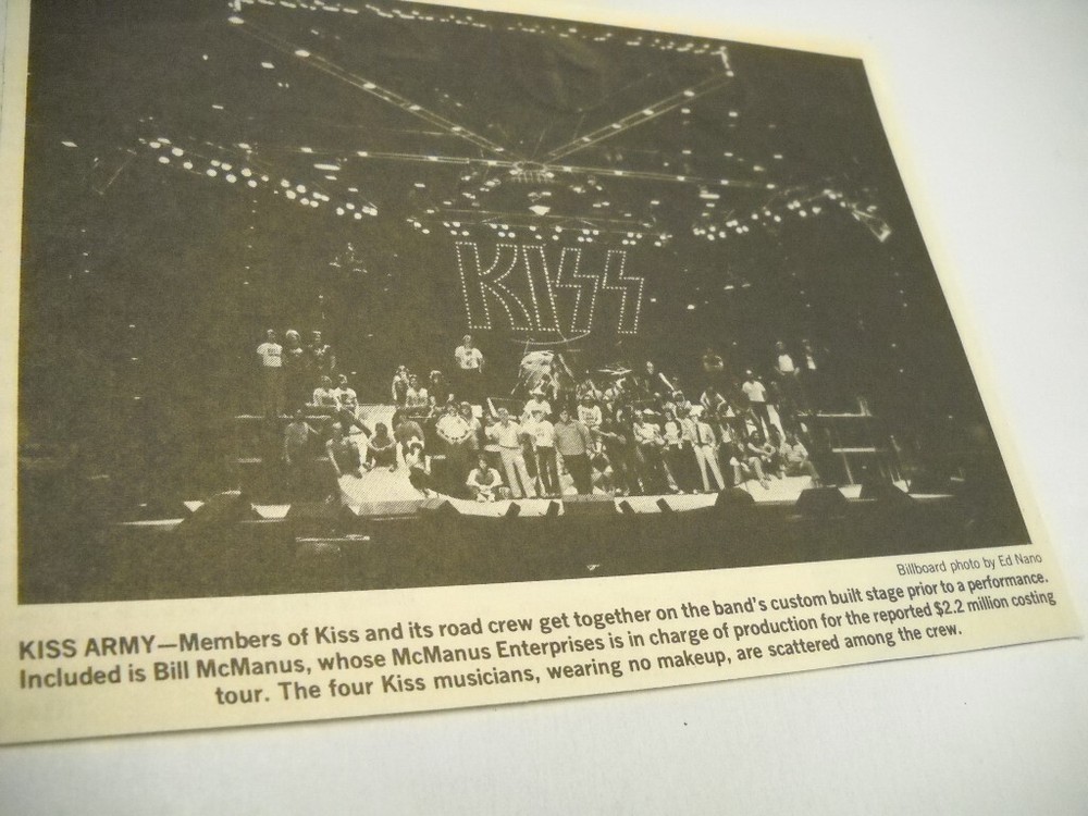 KISS (no makeup) scattered amongst road crew... 1979 music biz promo pic/text