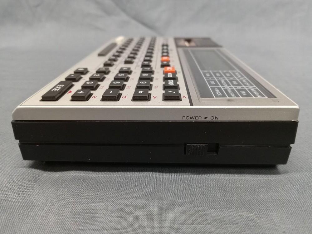 CASIO FX-820P Personal Computer With Charger Case and Manuals FULLY FUNCTIONAL!