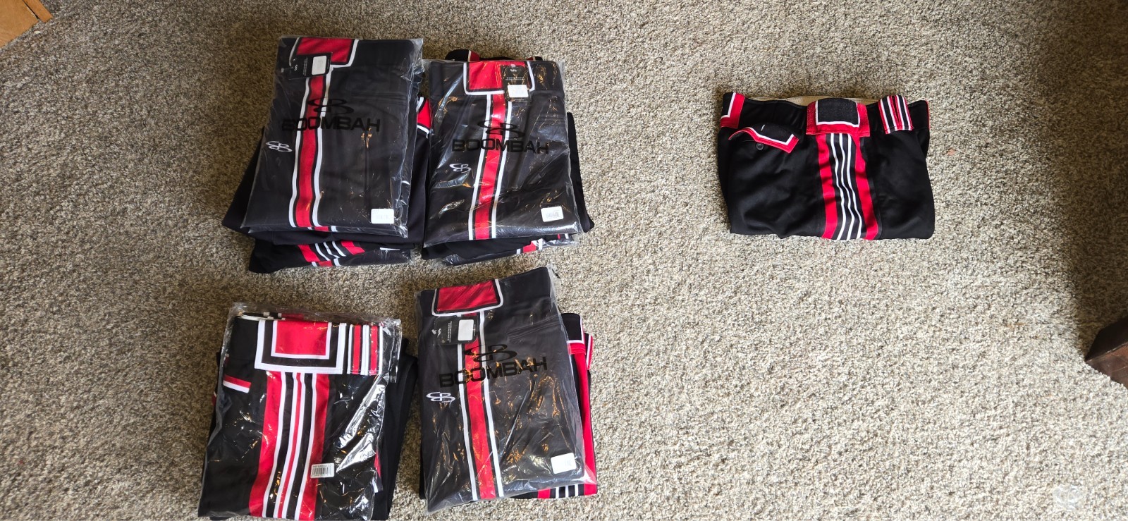 70 pairs Men's softball pants, White, Red, Black. Most new.