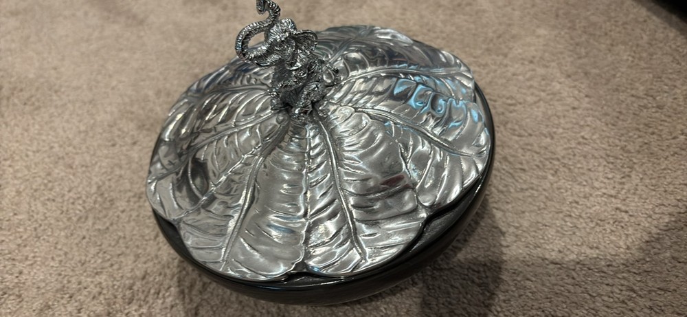 Decorative glass bowl with silver elephant handle lid