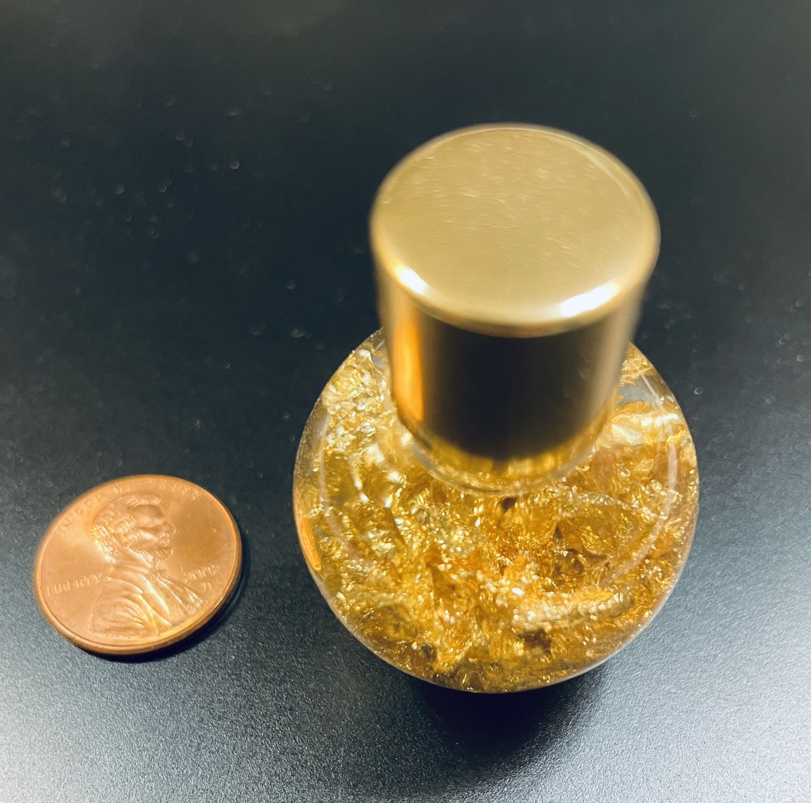 Pure Gold Leaf Flakes in a Sealed Bottle