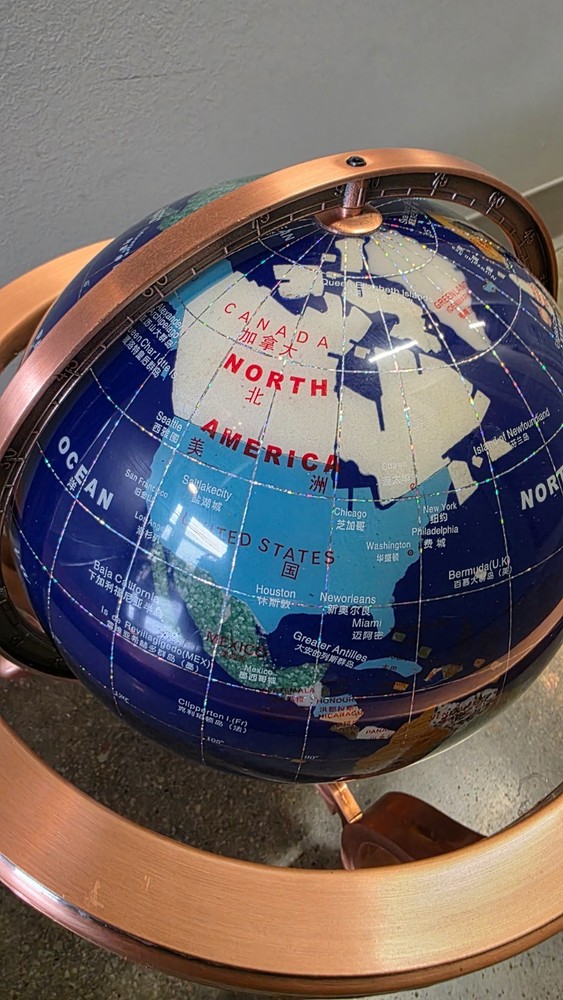 World Globe - Plastic Copper Rotating Base. From China