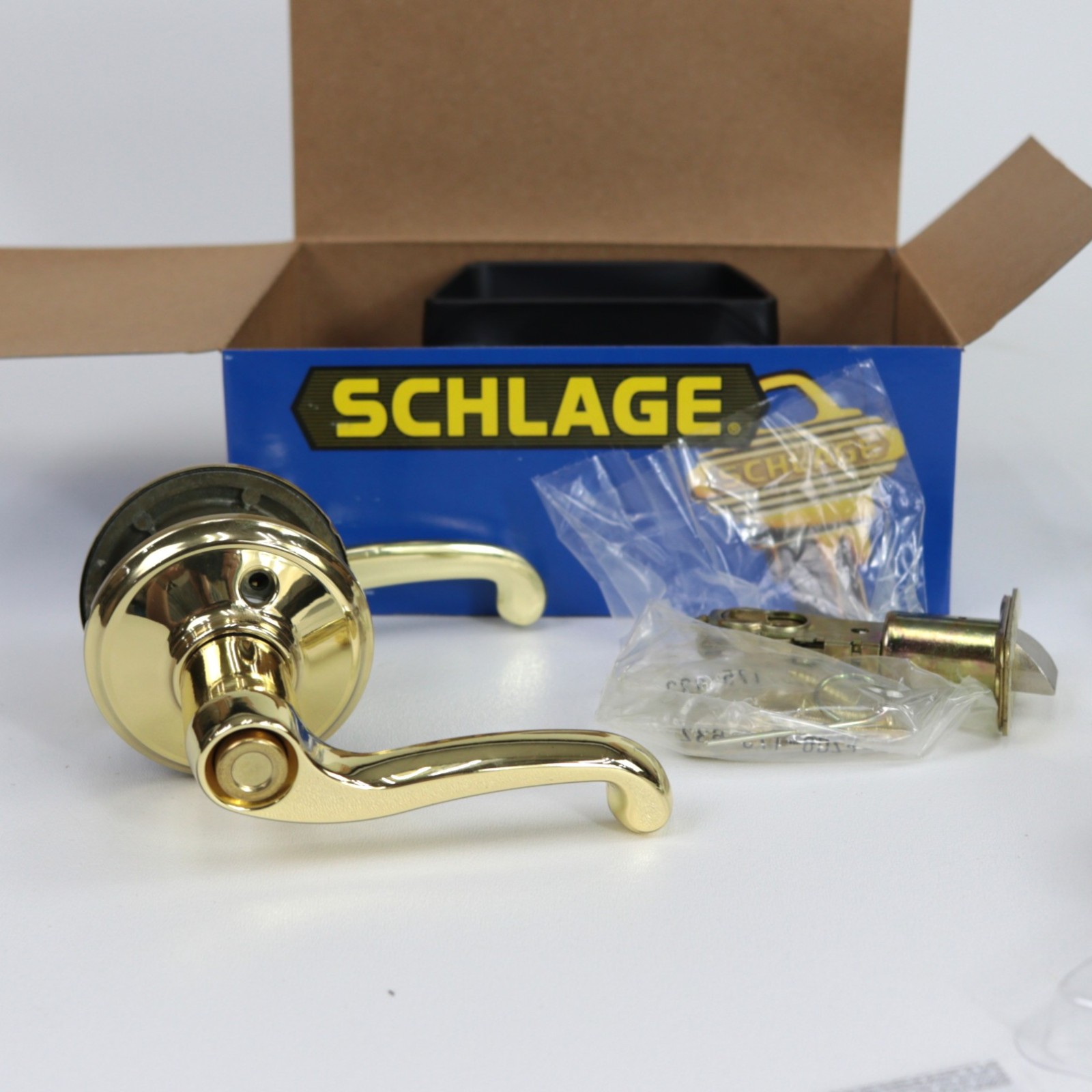 Schlage Flair Reversible Privacy Lock Lever Set in Polished Brass F40 FLA 605