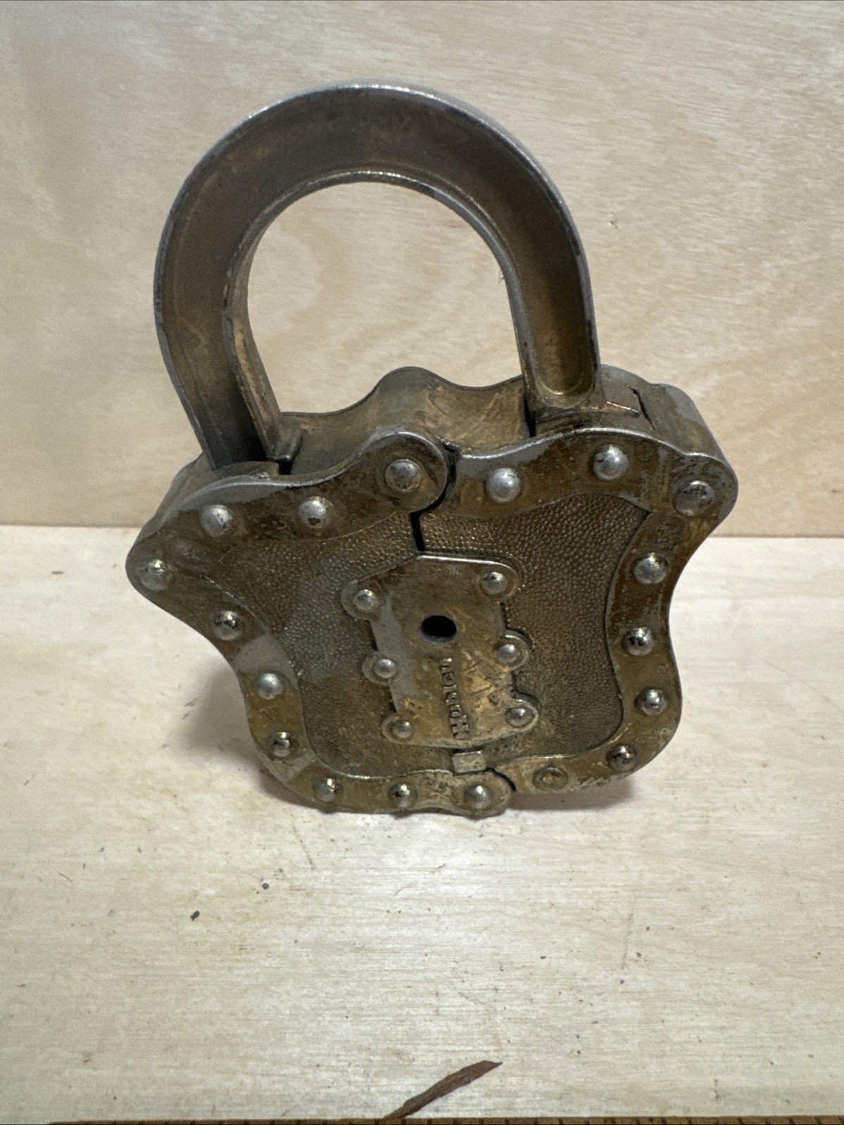 vintage Hubley Padlock Cap, a unique toy from the mid-20th century