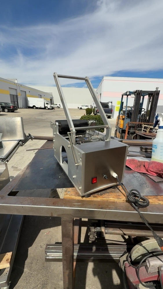 ELECTRIC BOTTLE LABEL APPLICATOR- USED