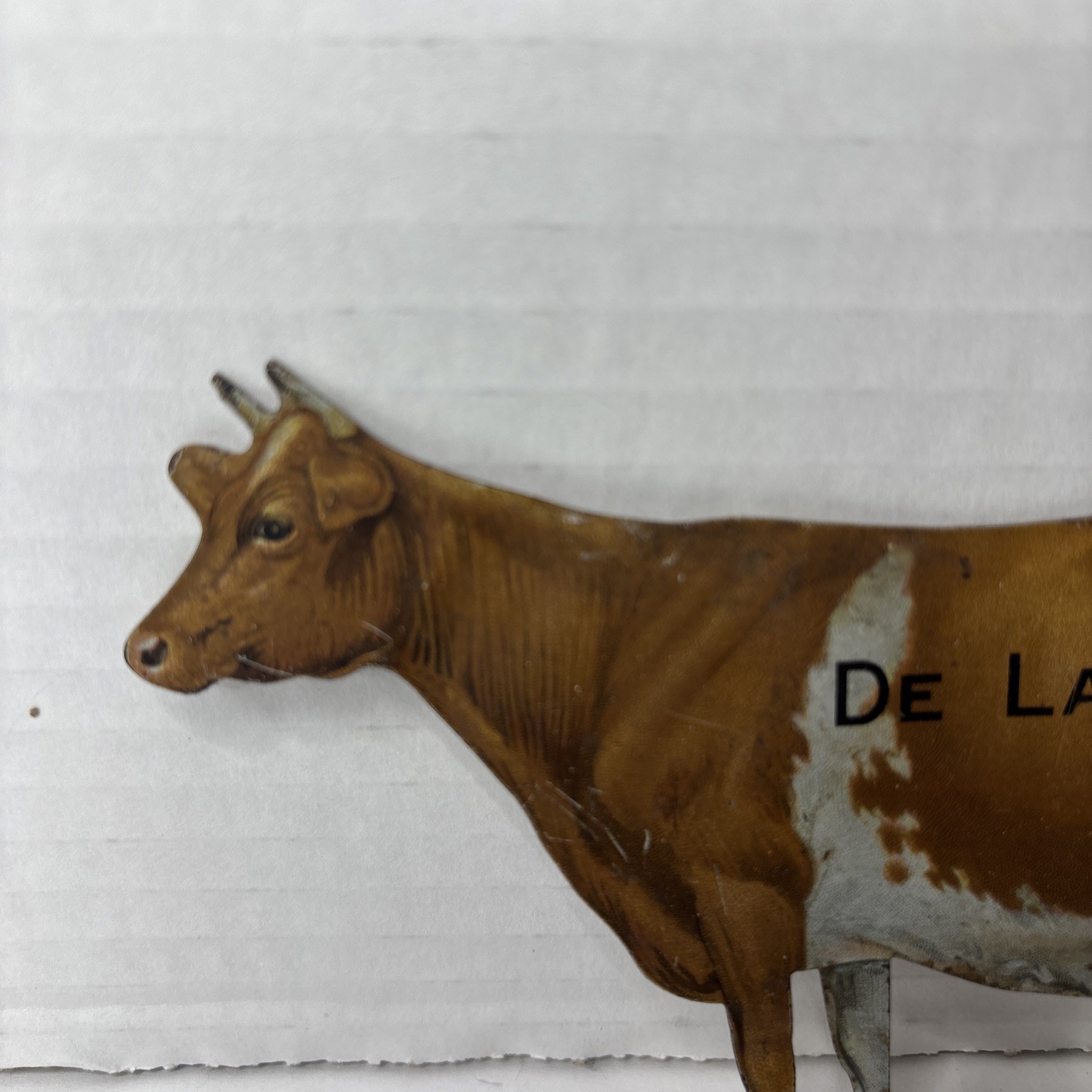 Pair of Antique DeLaval tin die cut cow and calf advertising cream separator ads
