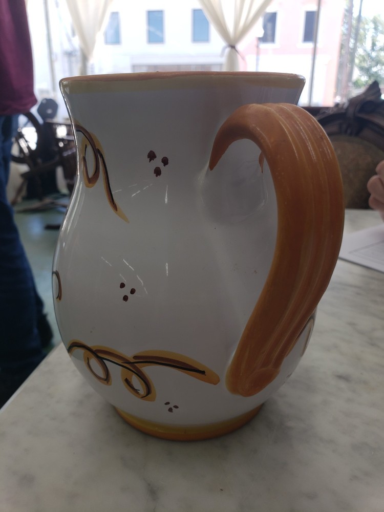 Hand painted, signed, ceramic pitcher,