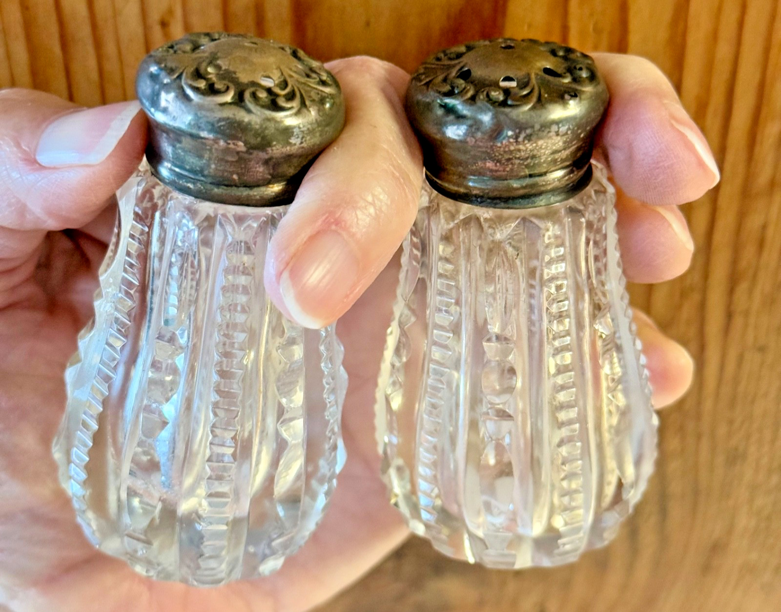 Antique beautiful cut glass with Gilded sterling lids salt and pepper shakers