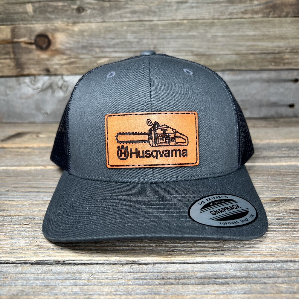 HUSQVARNA CHAINSAW LEATHER PATCH TRUCKER HAT