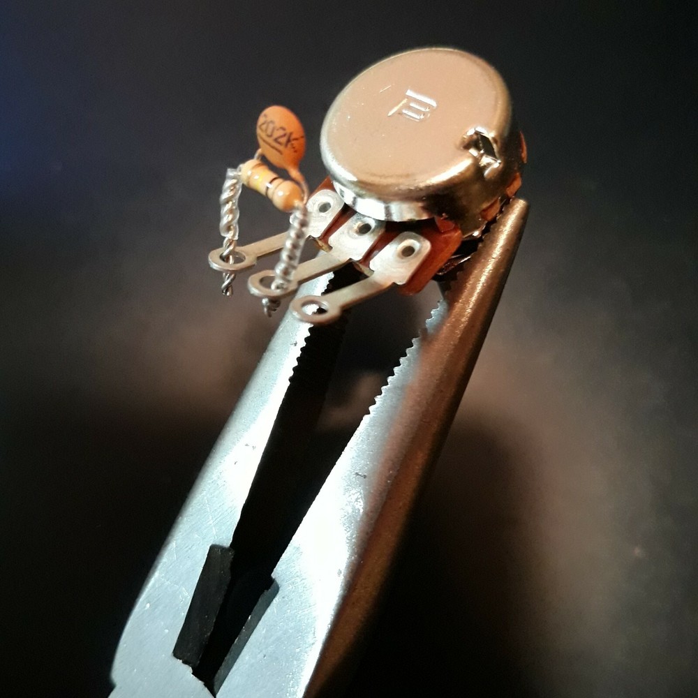 TREBLE BLEED KING  .002uF cap, 100K-ohm resistor in parallel