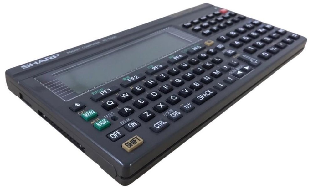 Sharp PC-E500 pocket computer 32KB memory large display BASIC language C338