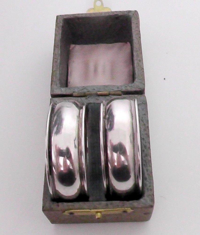 Boxed Pair of  Solid Silver Napkin Ring dates 1902