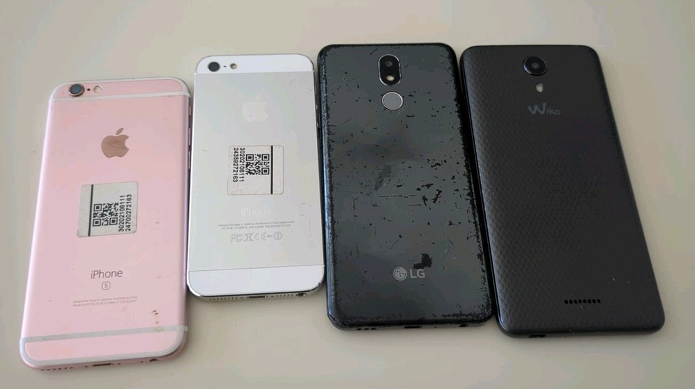 4 cell phones mixed lot. multiple different brands. untested for parts