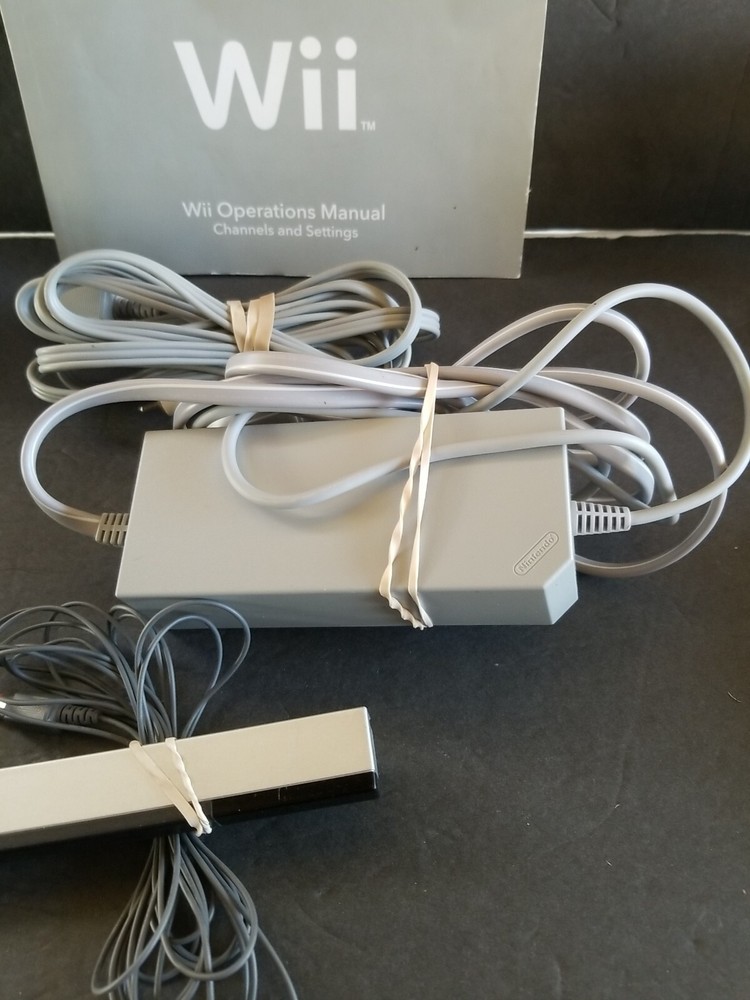 Nintendo Wii RVL-101 Black Console Bundle W/ Wii PlayController & Nunchuck book