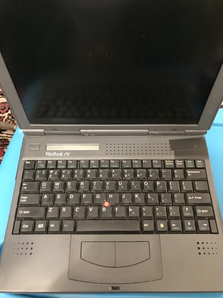 WINBOOK FX /INCLUDES ADAPTER /NEEDS TESTING/COSMETICALLY POOR