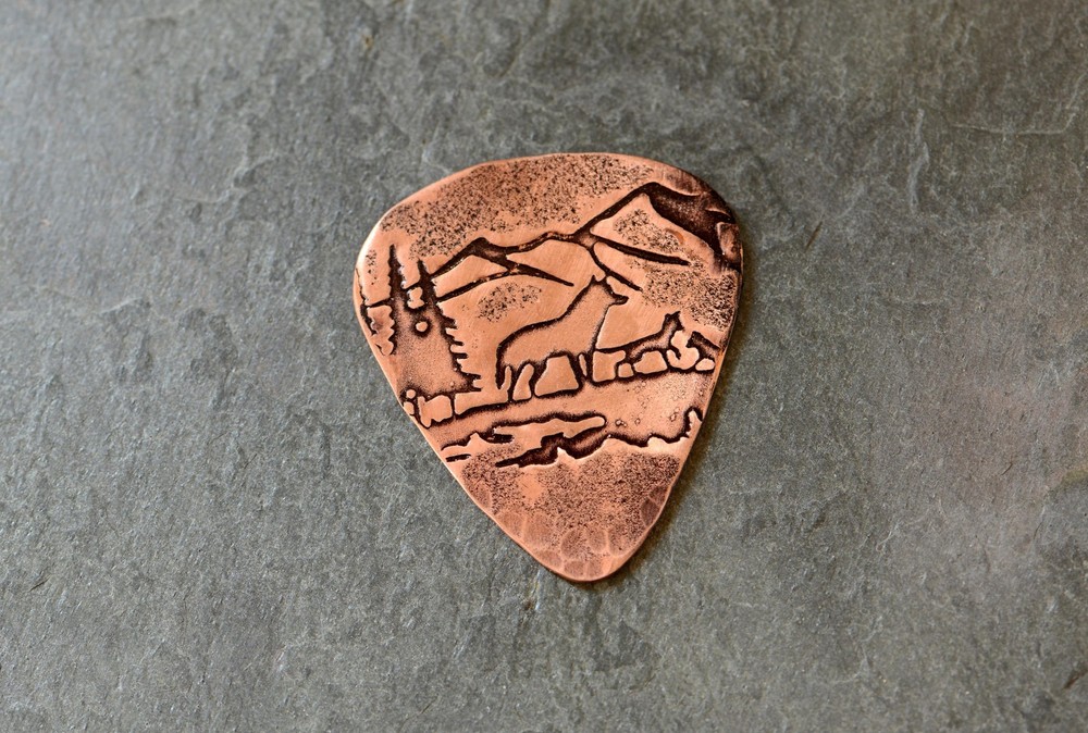 Copper guitar pick with wolves , mountains and forest - handmade and playable -