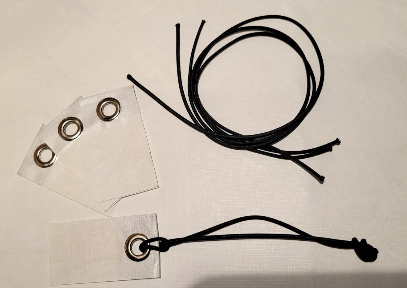 4 - Peel & Stick Grommet Tabs w/ Cords for Tyvek Homewrap Tent Footprint sheets