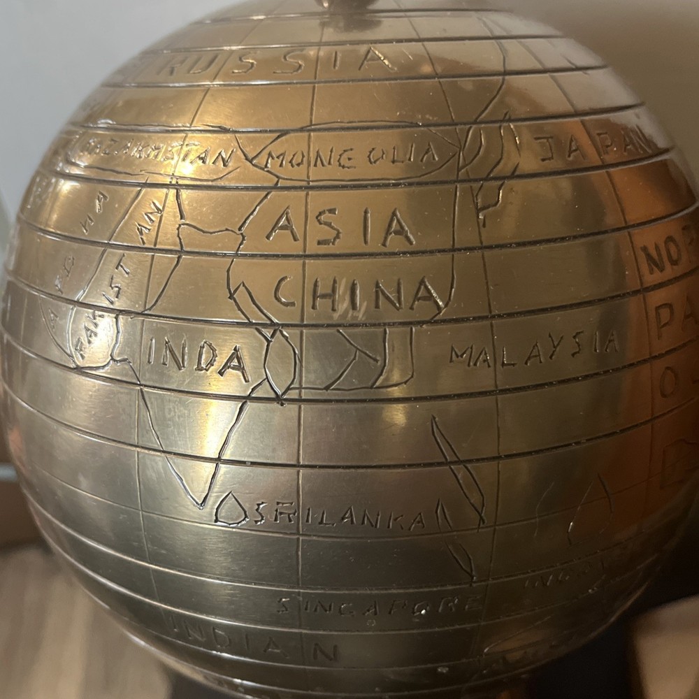Bains Kushnick Clock Globe
