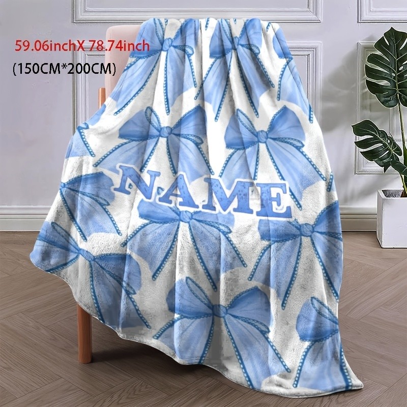 Customizable light blue flannel blanket with name and bow pattern♢