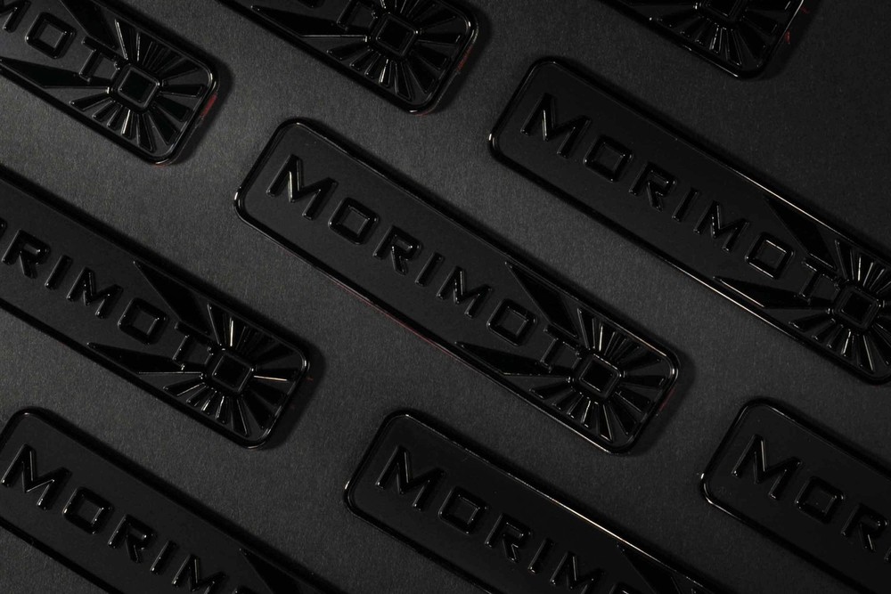 Morimoto Badge: (Black Chrome)
