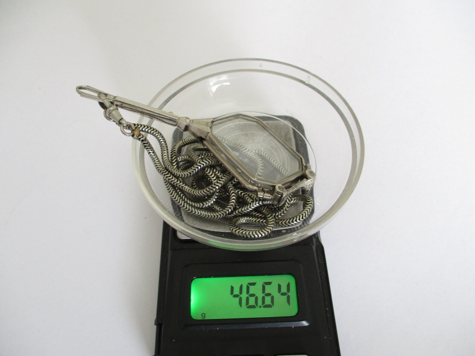 A Deco style lorgnette with guard chain