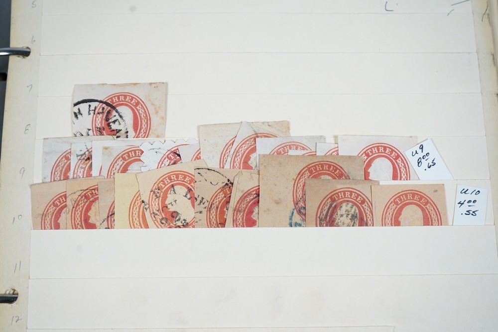 US COLLECTION OF 1,200+ STATIONERY CUT SQUARE STAMPS STORED IN STOCKBOOK