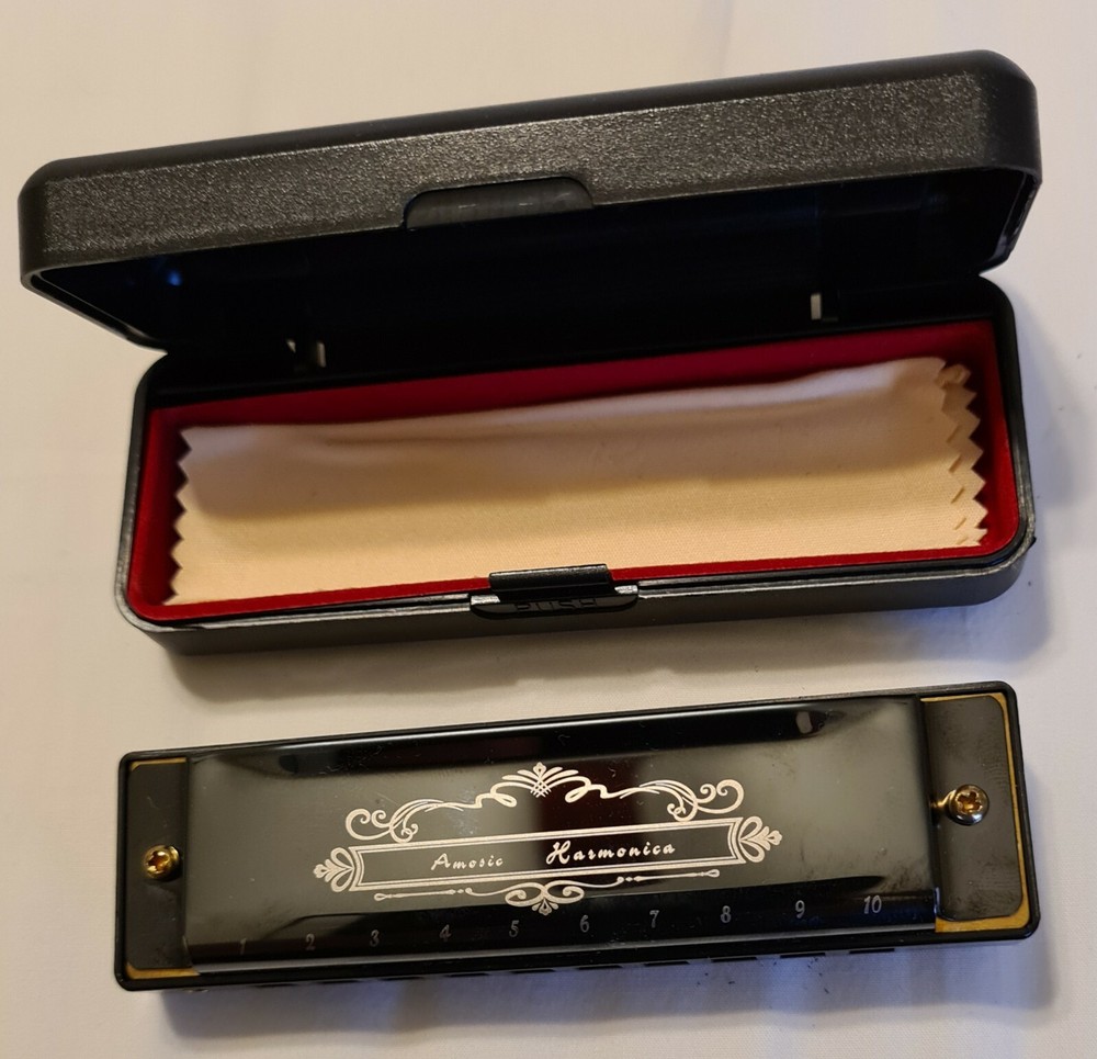 Amosic Harmonica new with box