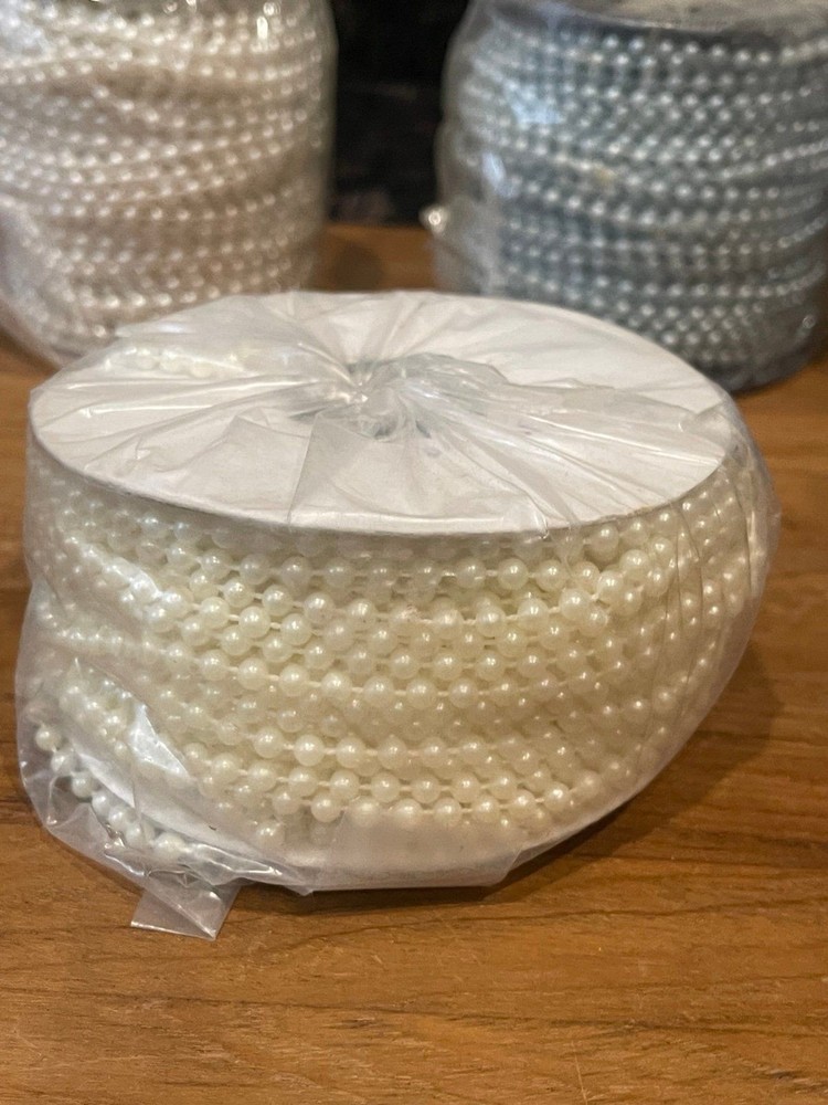 5 rolls of plastic string beads