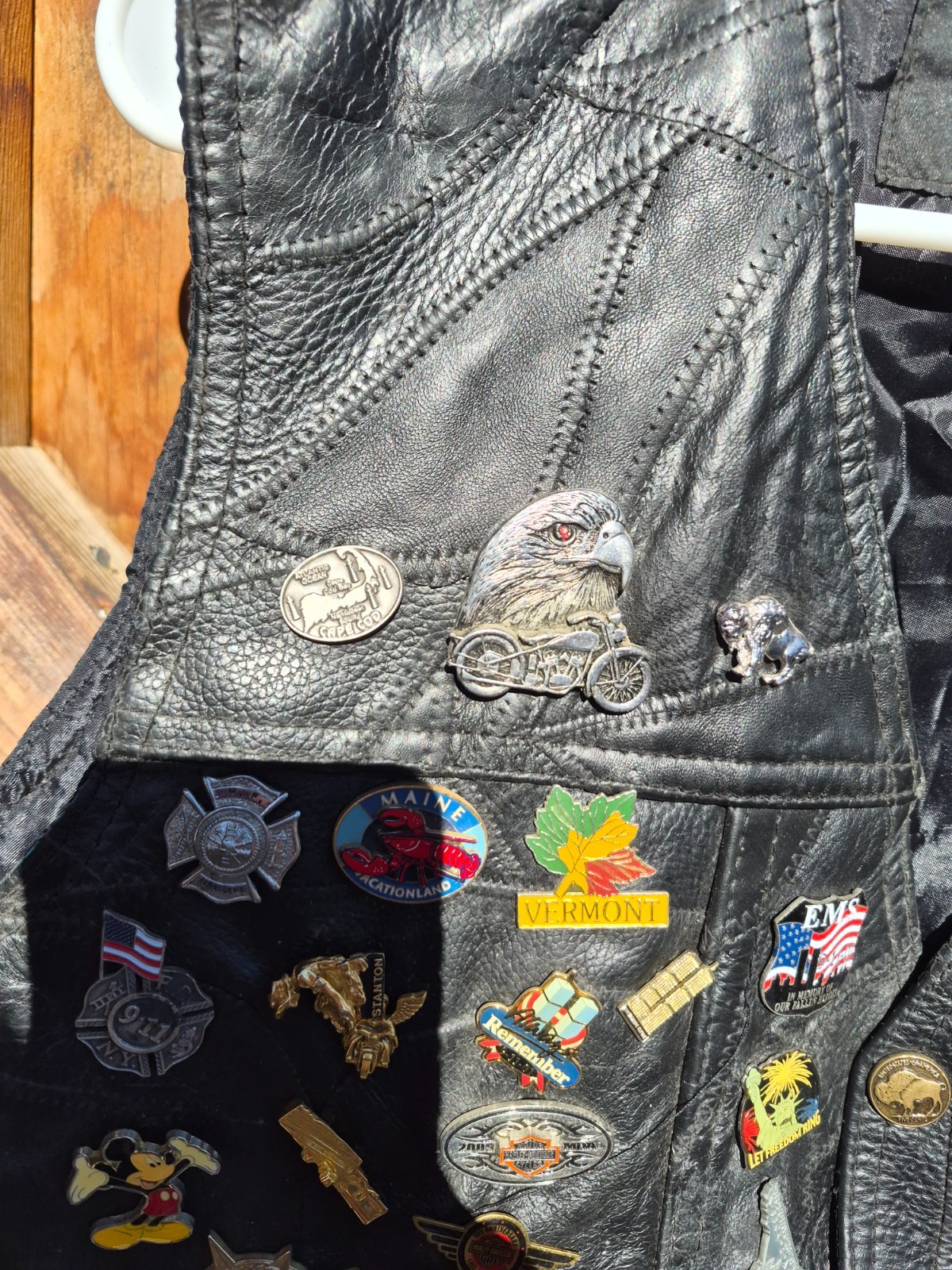 Vintage harley hog leather vest filled with pins and has patches 2xl