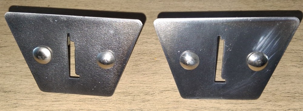 Two Gottlieb coin entry plates and hardware